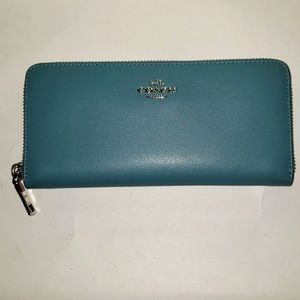 Never used. Coach large wallet. Beautiful slate blue color. A sophisticated look
